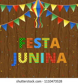 Festa Junina festival bunting and confetti on wooden background
