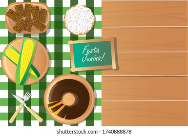 festa junina food table with green corn, carrot cake, popcorn and pe de moleque sweet top view