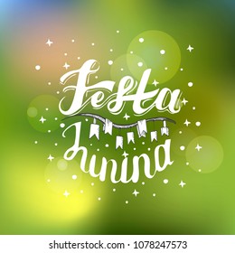 Festa Junina. Holiday card design for Brazilian June fest de Sao Joao on the blurred background. Lettering illustration.