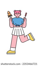 Festival. Cute little girl holding squid and tanghulu skewers, street food.