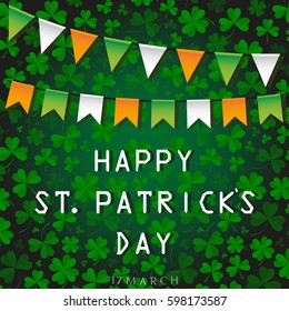 Festival flags in the colors of the Irish flag and the inscription of a happy St. patrick's day on a green background