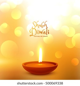 festival greeting of diwali with diya and bokeh effect (shubh translation happy)