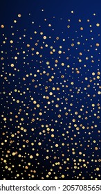 Festive amusing confetti. Celebration stars. Sparse gold confetti on dark blue background. Grand festive overlay template. Vertical vector background.