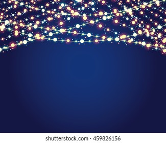 festive background with burning light bulbs on blue