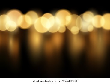 Fondo festivo de las luces de bokeh desenfocadas en oro