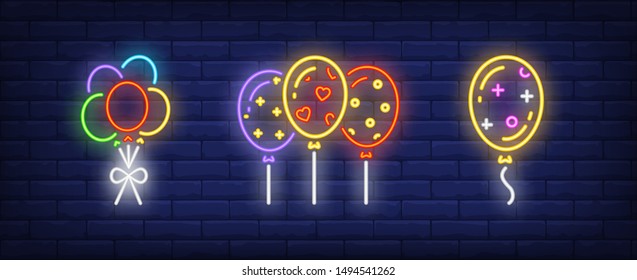 Festive balloons neon signs set. Birthday, anniversary, party design. Night bright neon sign, colorful billboard, light banner. Vector illustration in neon style.