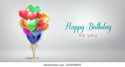 Festive birthday illustration with a bunch of colored heart shaped helium balloons and inscription Happy Birthday to you on white background