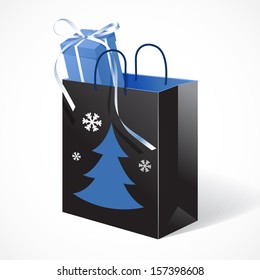 Festive black paper-bag with christmas tree, snowflakes and gift tied with a bow
