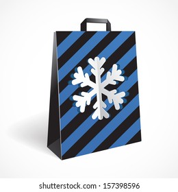 Festive black striped paper-bag with cut out snowflake