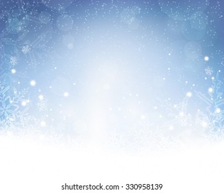 Festive blue white background with stars, snowflakes, out of of focus light dots and light effects which give it a festive and dreamy feeling. Copy space.