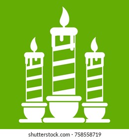 Festive candles icon white isolated on green background. Vector illustration