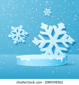 Festive Christmas podium with snowfall and large snowflakes in the background.
