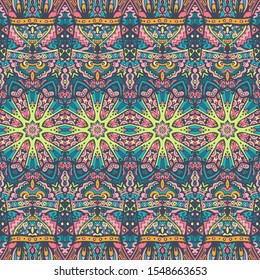 Festive colorful seamless pattern psychedelic doodle art. Ethnic tibal colorful graphic ornament