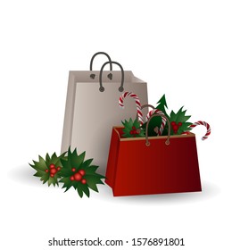 Festive composition with Christmas tree branches and sweets in a gift bag on a white background.