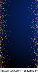 Festive energetic confetti. Celebration stars. Rainbow bright stars on dark blue background. Fine festive overlay template. Vertical vector background.