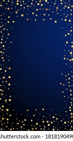 Festive fabulous confetti. Celebration stars. Sparse gold confetti on dark blue background. Graceful festive overlay template. Vertical vector background.