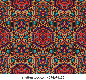 un patrón festivo kaleidoscópico sin fisuras de origen étnico tribal