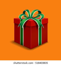 Festive gift box red. Tied with green ribbon with a bow on top.