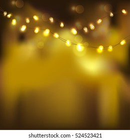 Festive gold light on black background. Horizontal line of gold glitter.