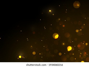 Festive golden luminous background with colorful lights bokeh. Sparkling magical dust particles. The dust sparks and golden stars shine with special light on a black background. Christmas concept.