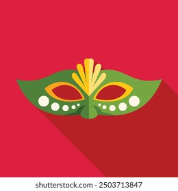 Festive green and yellow carnival mask is lying on a red background, bringing the spirit of celebration and disguise