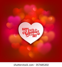 Festive greeting card for Valentines Day with calligraphic text Happy Valentines day on blurred background with hearts. Vector illustration.