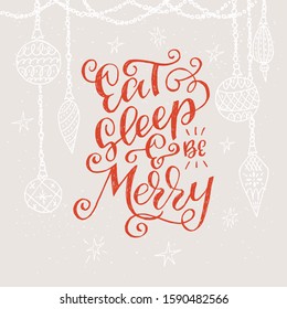 Festive handwritten saying Eat Sleep And Be Merry on beige background decorated with Christmas tree ornaments. Tender greeting hand drawn with red curly letters. Seasonal cover, template, print.