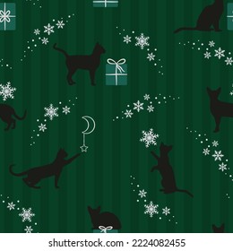 Festive seamless pattern. Cats playing with stars, gifts and snowflakes. Magical Christmas scene. Vector illustration on a green striped background with silver elements.