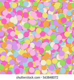 Festive seamless pattern with confectionery sprinkling. Random mess repeated texture of pink, yellow, purple color. Bright and colorful vector background
