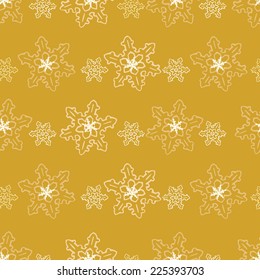Festive seamless pattern of snowflakes in shades of gold/Seamless pattern of golden snowflakes