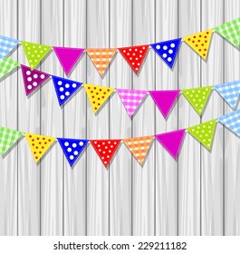 festive small flags on a background wooden texture, vector illustration