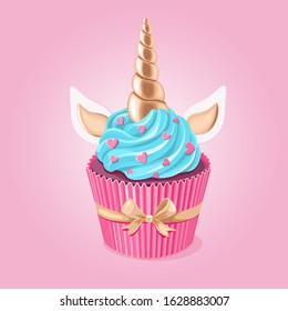 Festive unicorn cupcake.  Cake with golden horn and cream on pink background