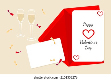 Festive Valentines day card composition with envelope, blank card and two glasses of chapagne