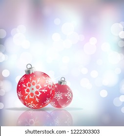 Festive winter background with red holiday balls against defocused bokeh festive lights