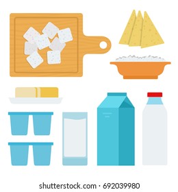Feta cheese on a wooden board, cottage cheese, hard cheese, butter, cream in a package, milk in a glass and kefir in a bottle vector flat material design isolated on white