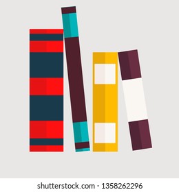 few educational books lying on each other with grey background 