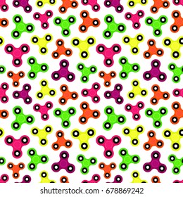 Fidget spinner. Hand toy for stress relief. Seamless pattern with colorful spinners for wrapping paper, wallpaper, web page background and more. Vector illustration. EPS10.