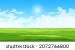 Field on sunny day with sun and clouds, empty green meadow