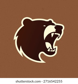 A fierce bear head logo with an open mouth and sharp teeth, suitable for sports teams or brands.
