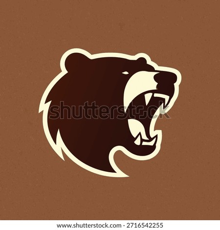 A fierce bear head logo with an open mouth and sharp teeth, suitable for sports teams or brands.