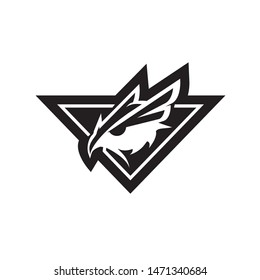 A fierce and minimalist vector mascot featuring a stylized owl head integrated into a sharp triangular shield. The design uses a high-contrast black and white style, symbolizing wisdom, night vision, strategic surveillance, and elite protection. This powerful emblem is ideal for esports teams, private security firms, cybersecurity brands, tactical outdoor gear, and software development agencies seeking a bold and vigilant identity.