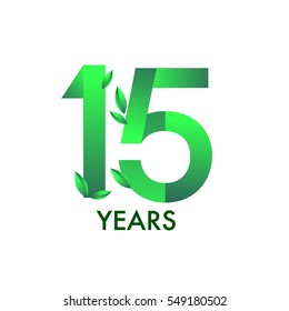 fifteen years anniversary celebration logotype with leaf and green colored. 15th birthday logo on white background