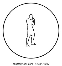 Fighter in fighting stance Man doing exercises Sport action male Workout silhouette side view icon black color outline vector illustration flat style simple image in circle round