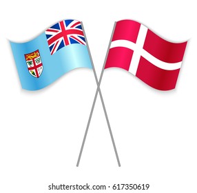 Fijian and Danish crossed flags. Fiji combined with Denmark isolated on white. Language learning, international business or travel concept.