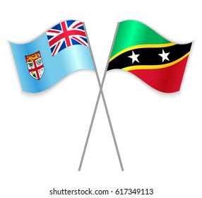Fijian and Kittitian crossed flags. Fiji combined with Saint Kitts and Nevis isolated on white. Language learning, international business or travel concept.