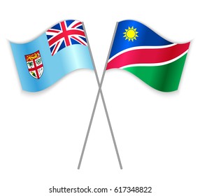 Fijian and Namibian crossed flags. Fiji combined with Namibia isolated on white. Language learning, international business or travel concept.