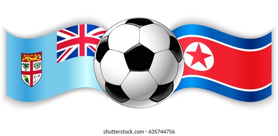 Fijian and North Korean wavy flags with football ball. Fiji combined with North Korea isolated on white. Football match or international sport competition concept.