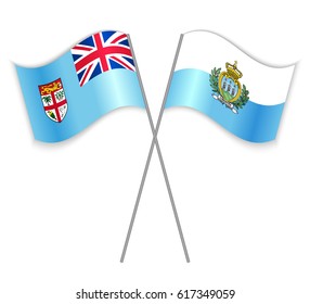 Fijian and Sammarinese crossed flags. Fiji combined with San Marino isolated on white. Language learning, international business or travel concept.