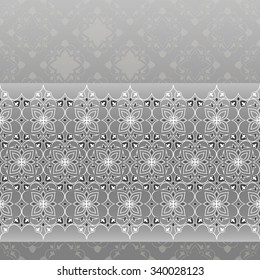 Filigree seamless border on gray. Ornate element for design and place for text. Ornamental lace pattern for wedding invitations and greeting cards. Traditional white decor on gray background.