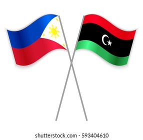 Filipino and Libyan crossed flags. Philippines combined with Libya isolated on white. Language learning, international business or travel concept.